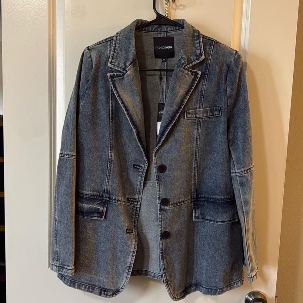 Fashion Nova denim jacket with faux pockets , no stretch fits average